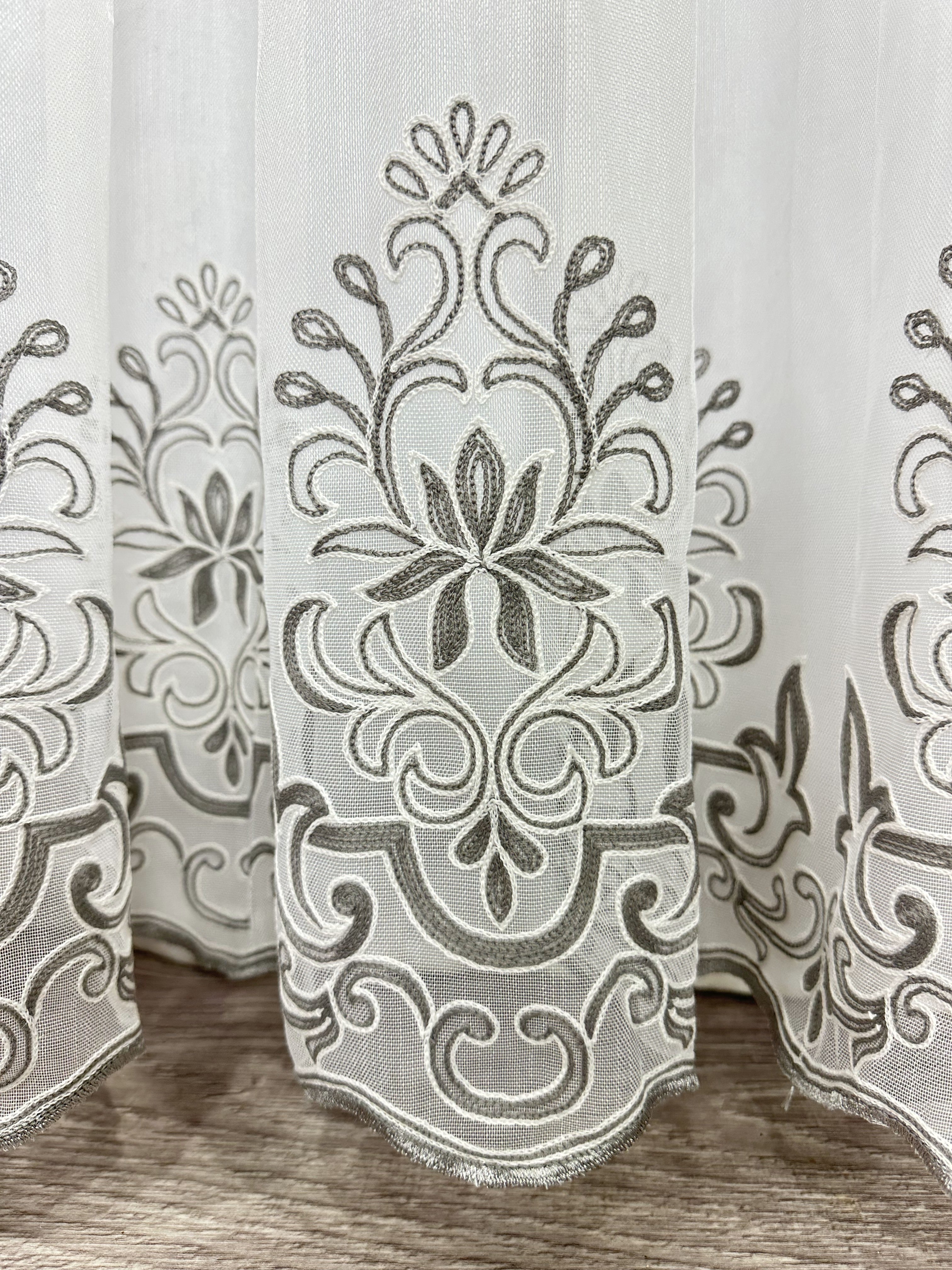 Sheer curtain with chenille embroidery on the bottom , gray color