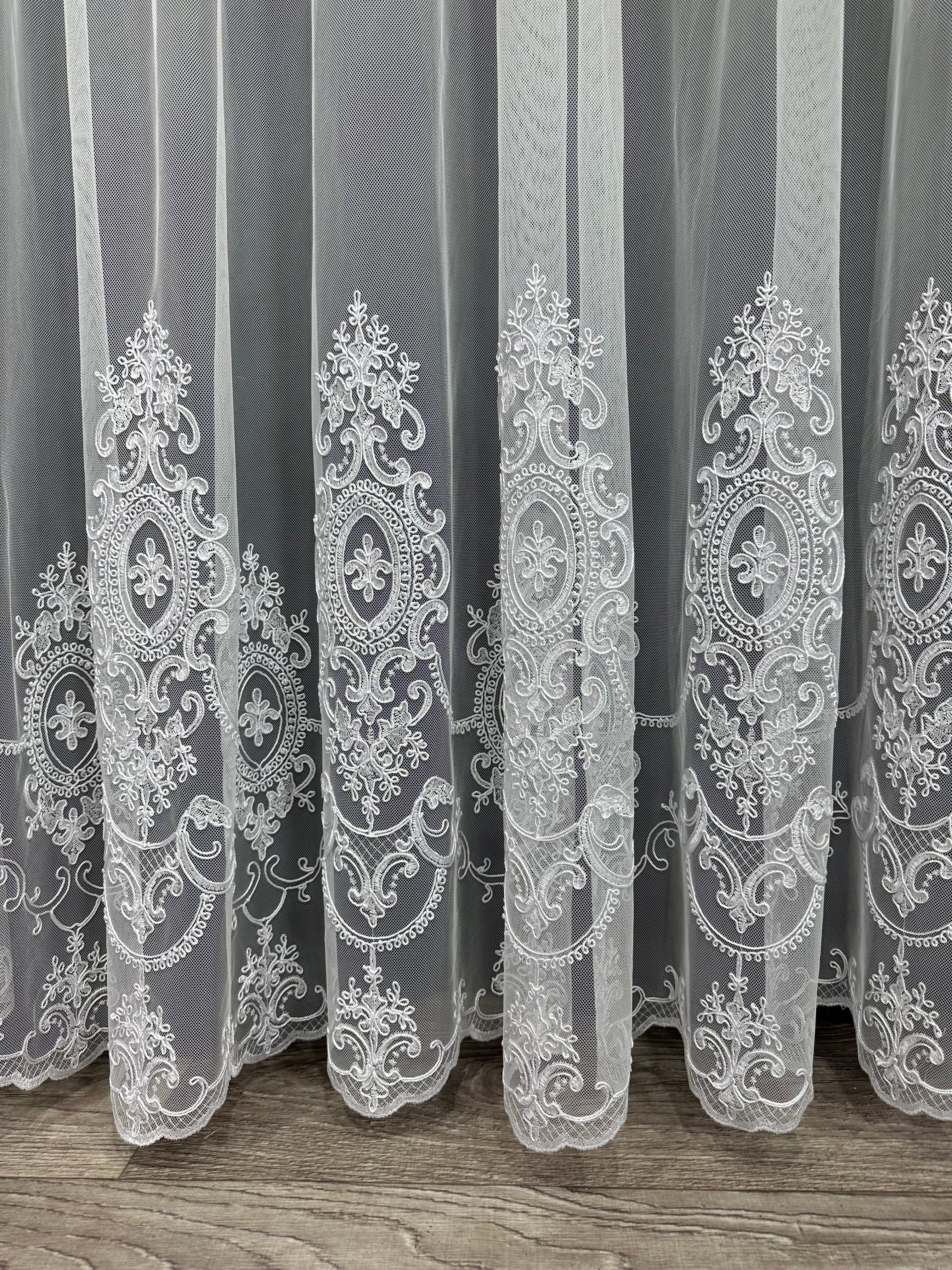 Sheer curtain based on tulle with embroidery on the bottom, white color