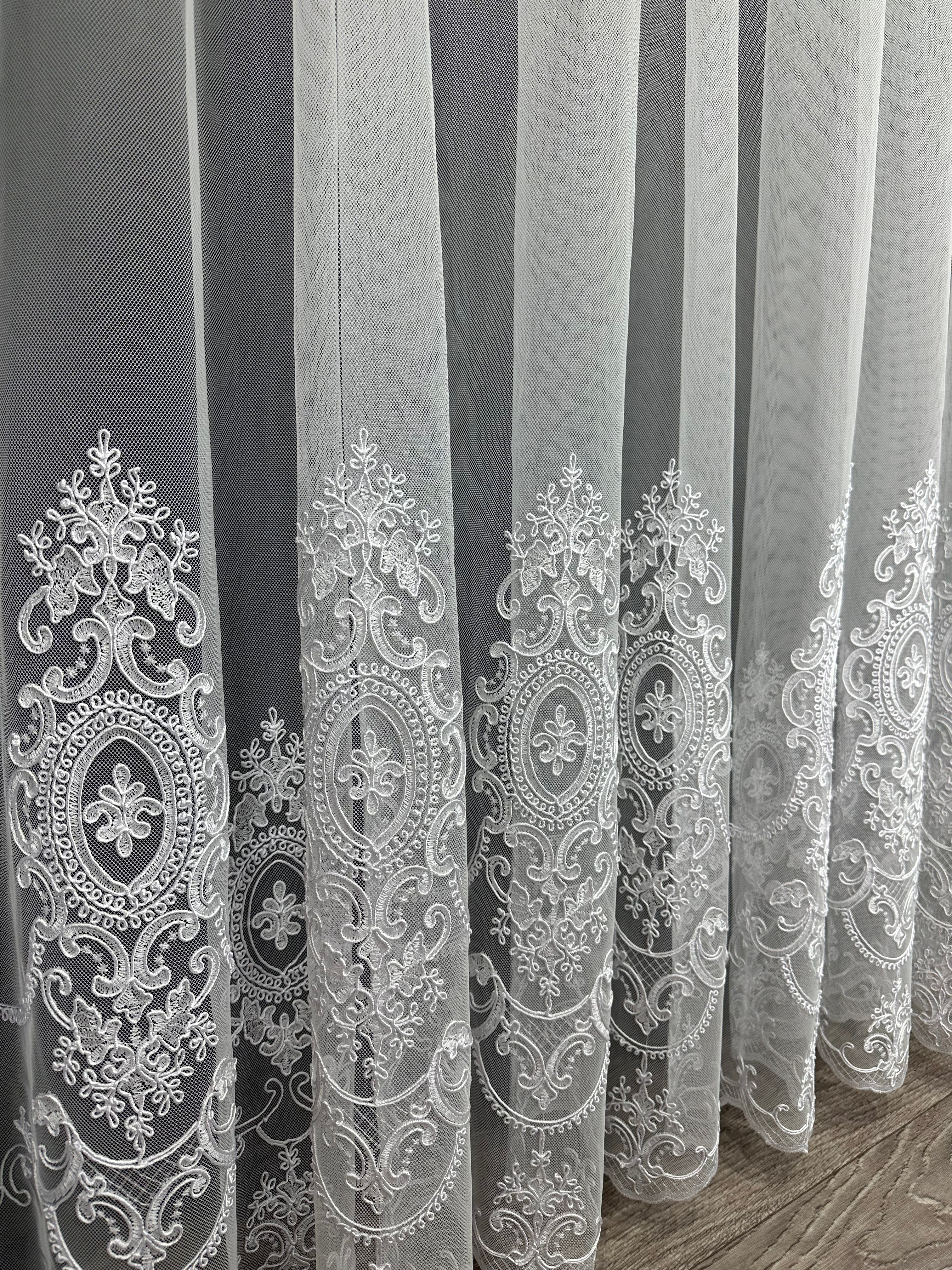 Sheer curtain based on tulle with embroidery on the bottom, white color
