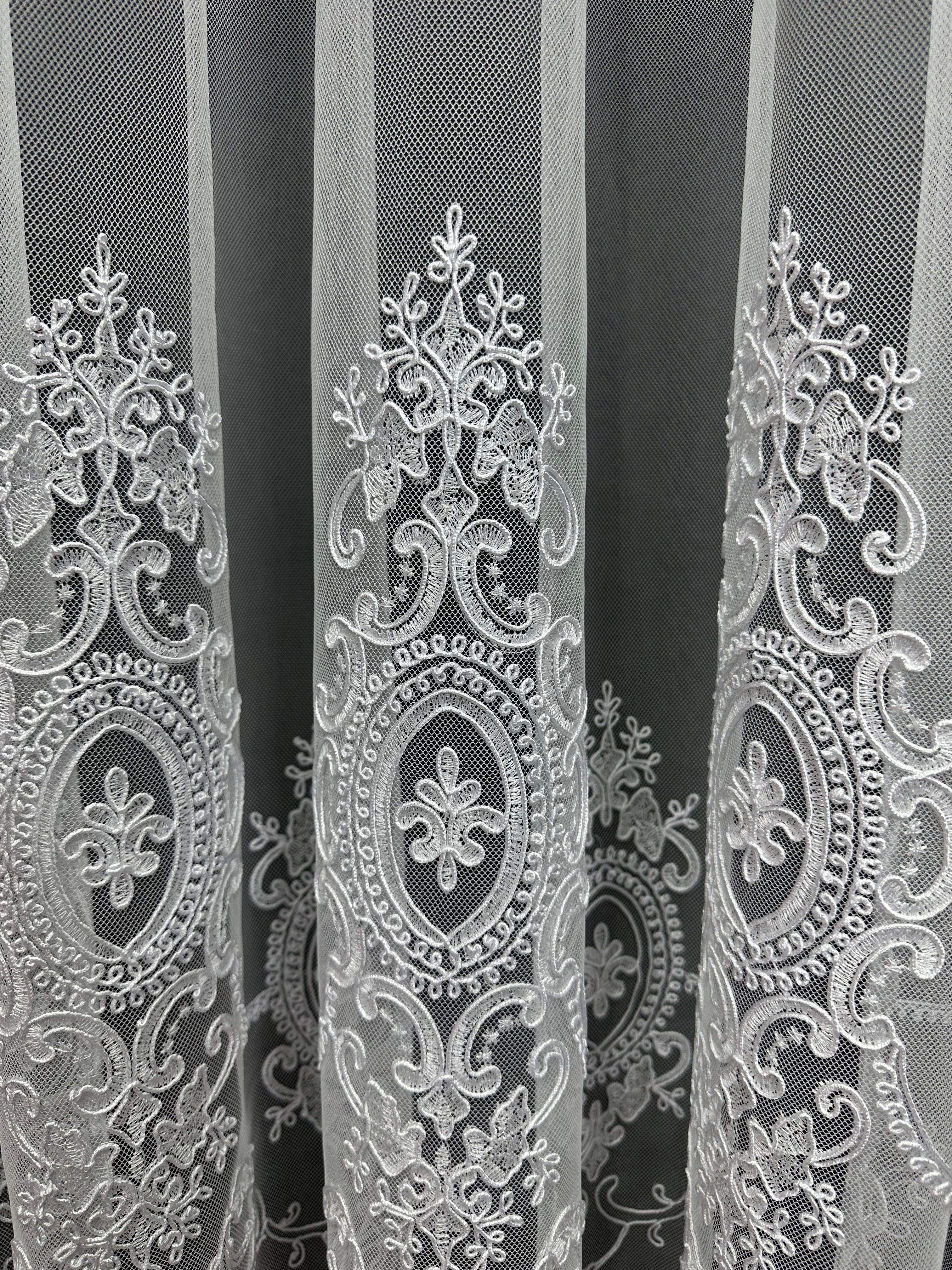 Sheer curtain based on tulle with embroidery on the bottom, white color