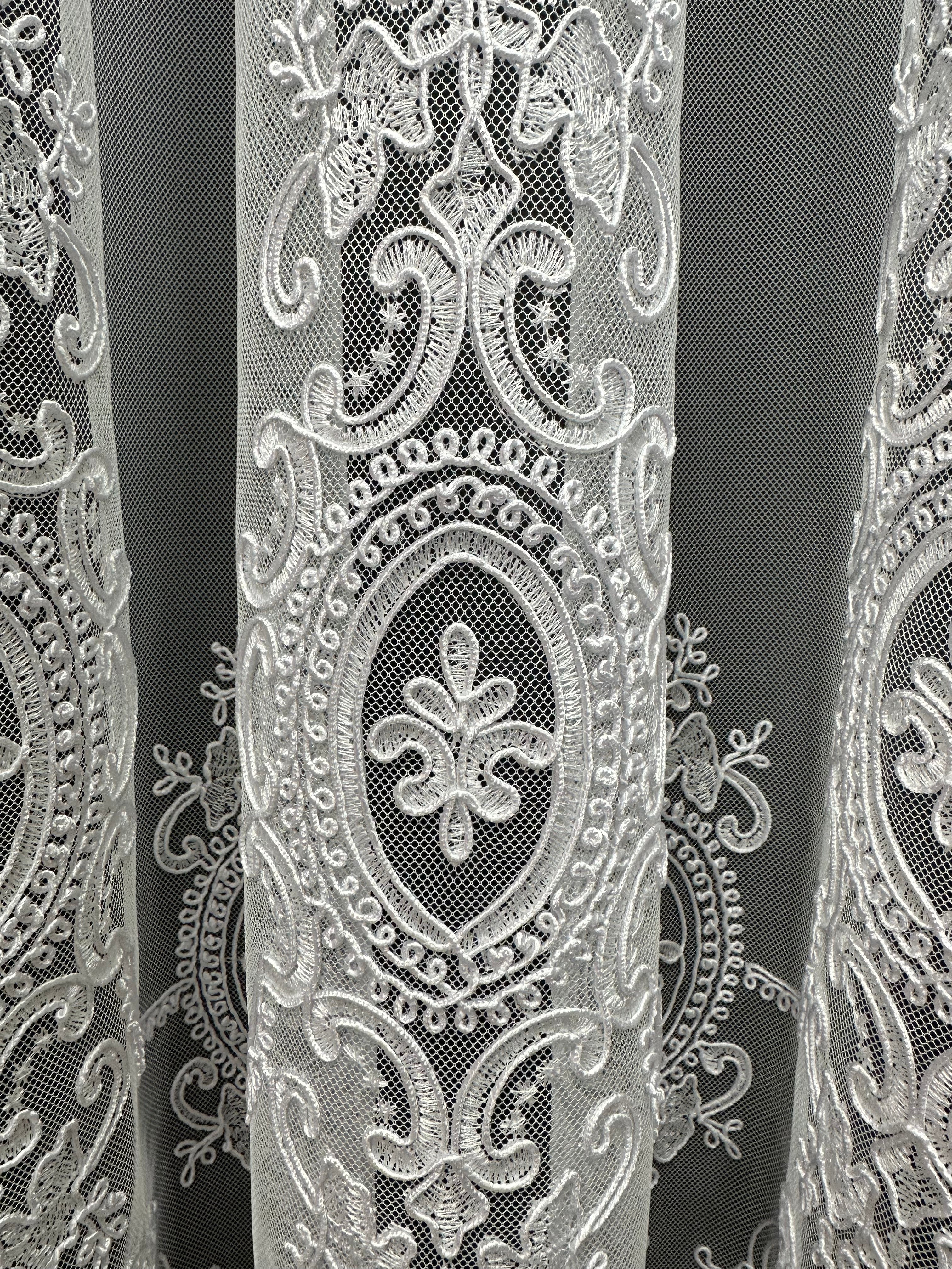 Sheer curtain based on tulle with embroidery on the bottom, white color