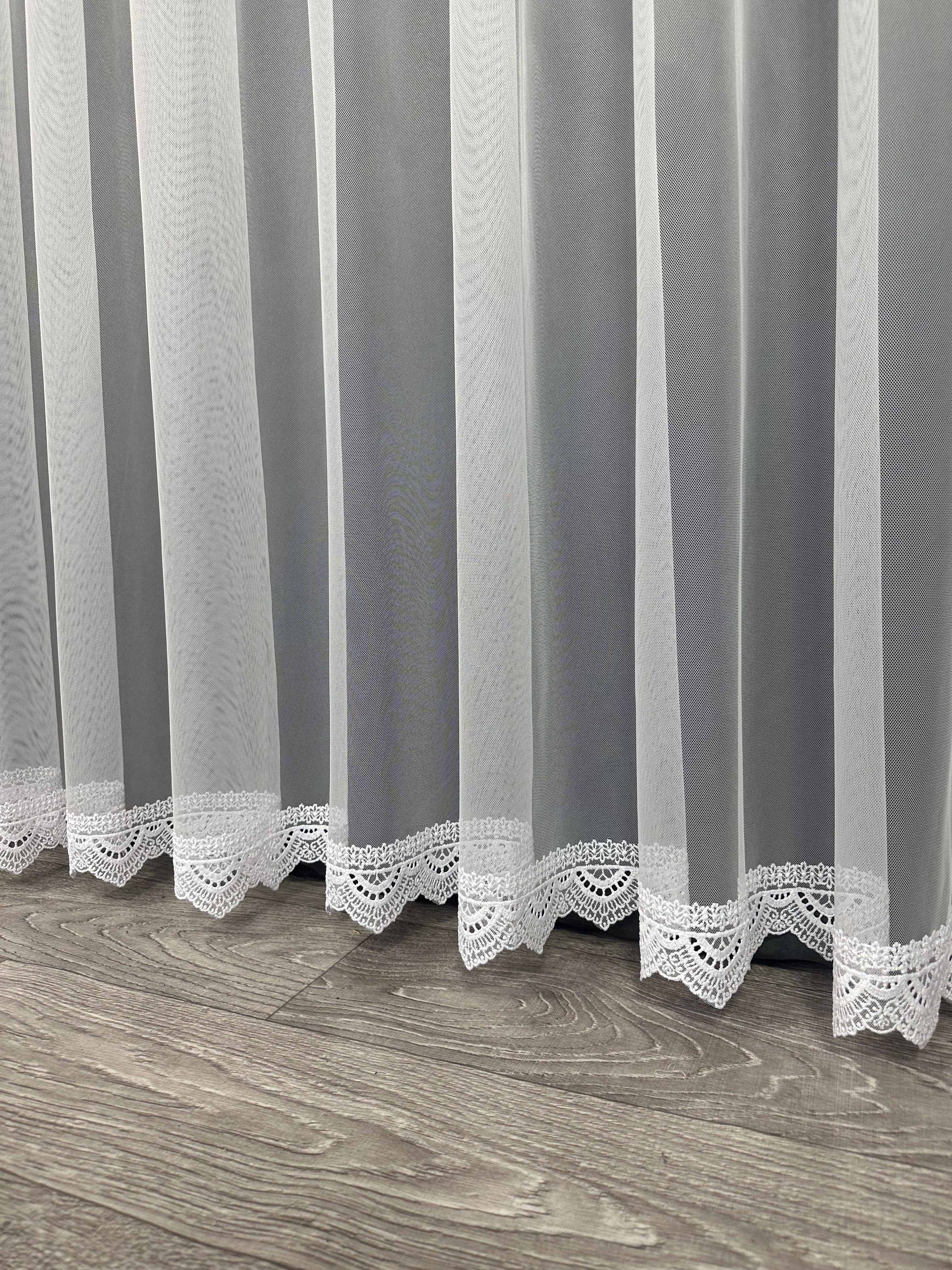 Sheer curtain with beautiful embroidery at the bottom, white color