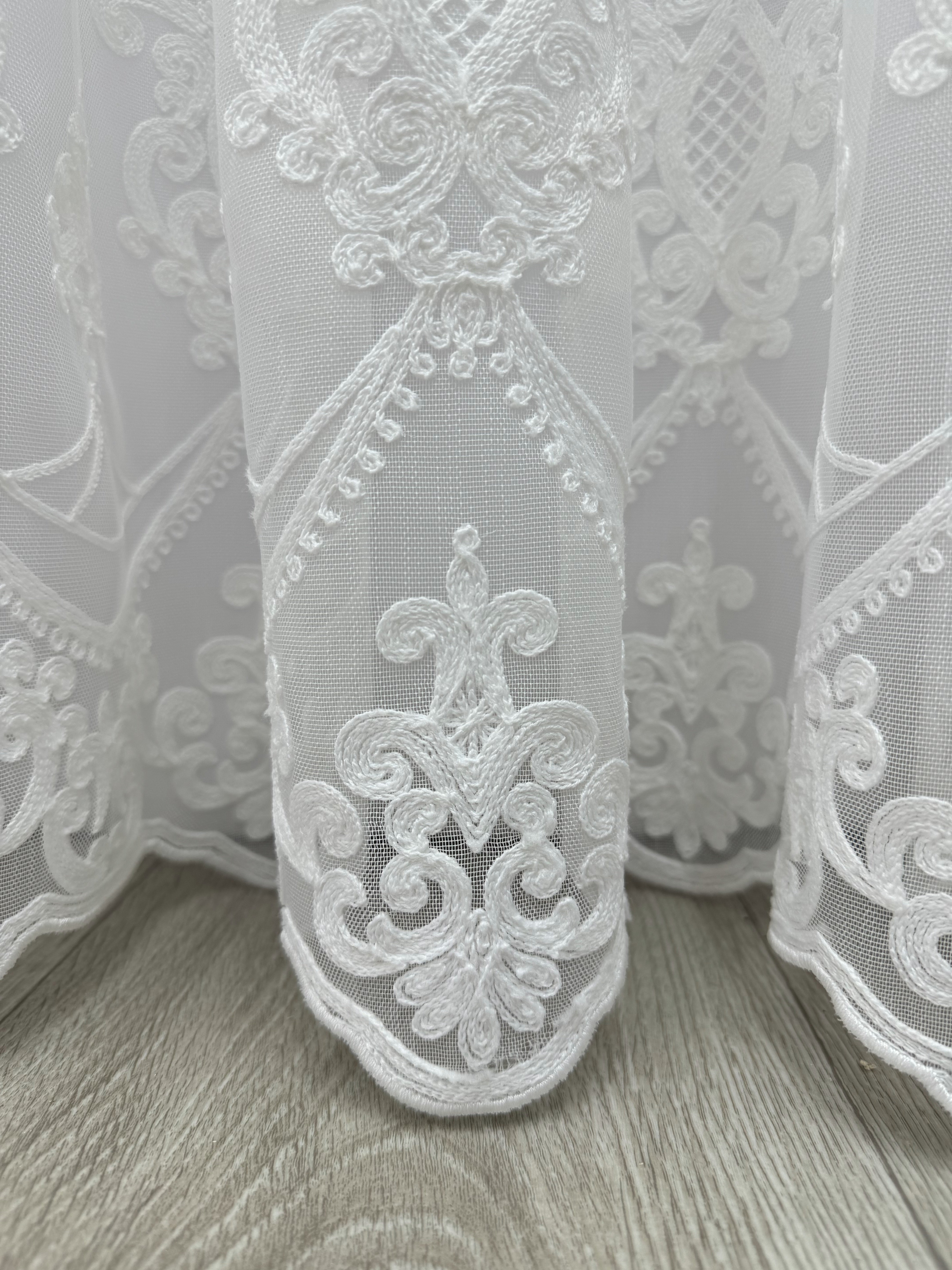 Sheer curtain with chenille embroidery on the bottom , milk color