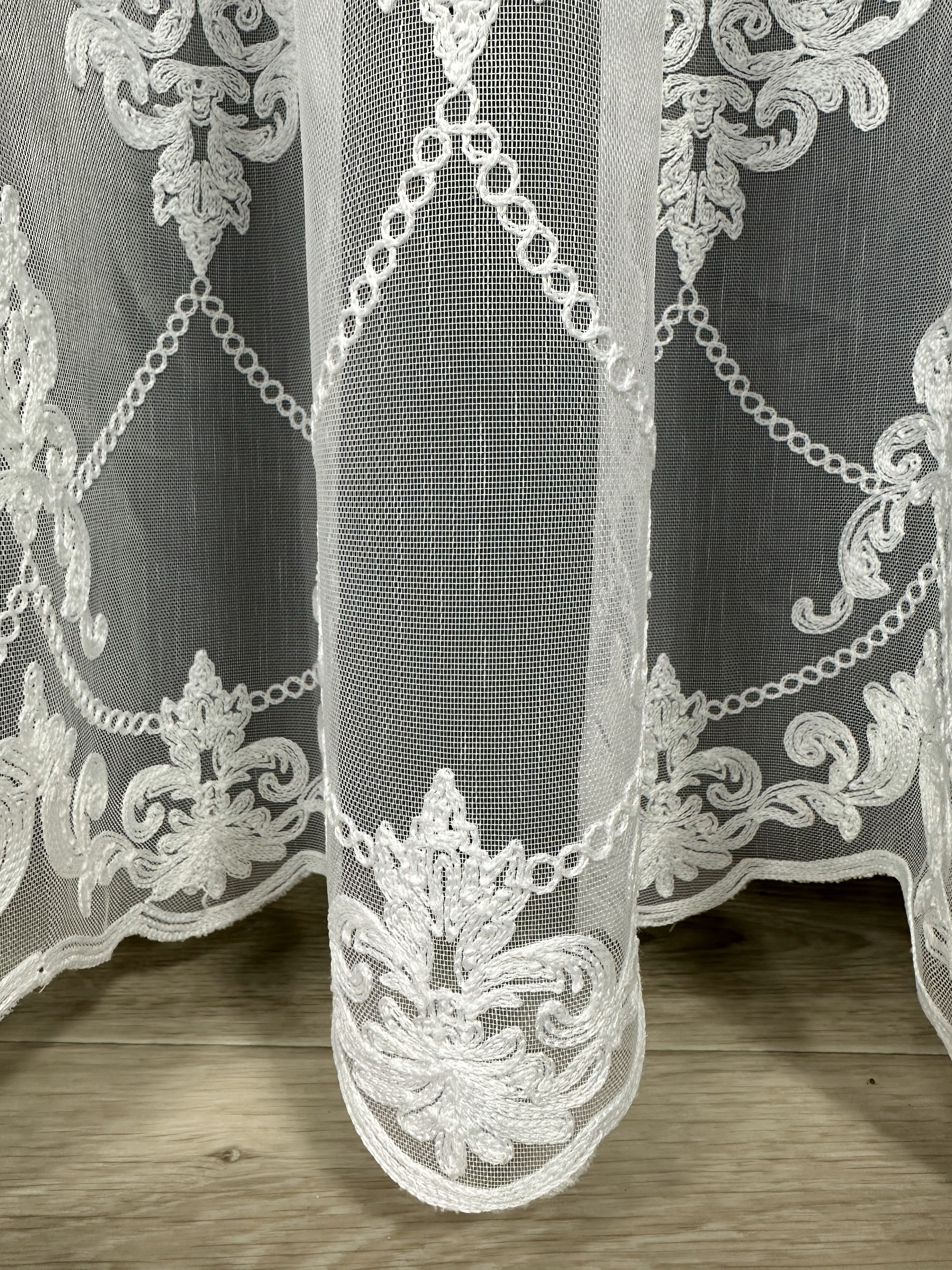 Sheer curtain with chenille embroidery on the bottom , milk color