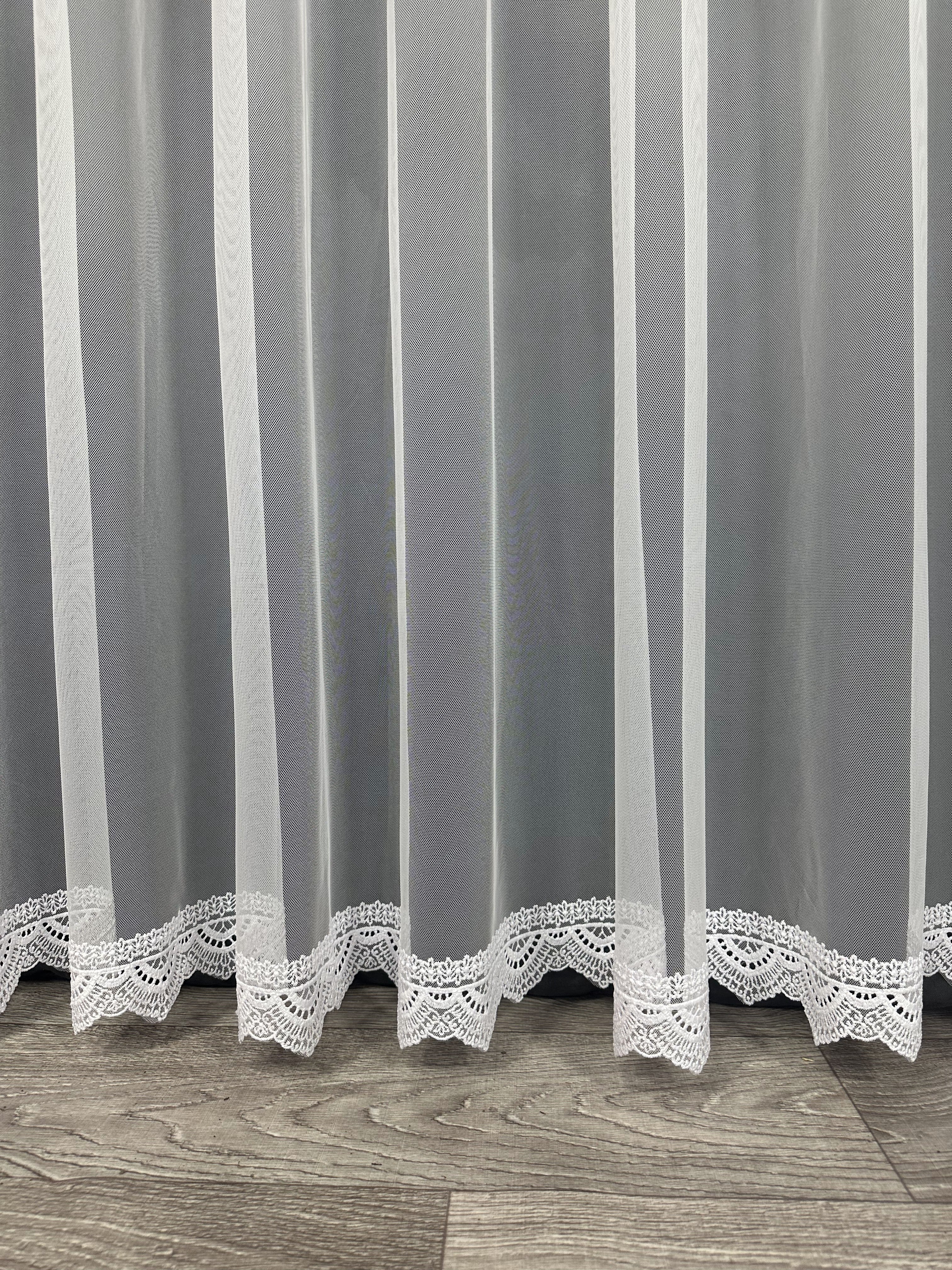 Sheer curtain with beautiful embroidery at the bottom, white color