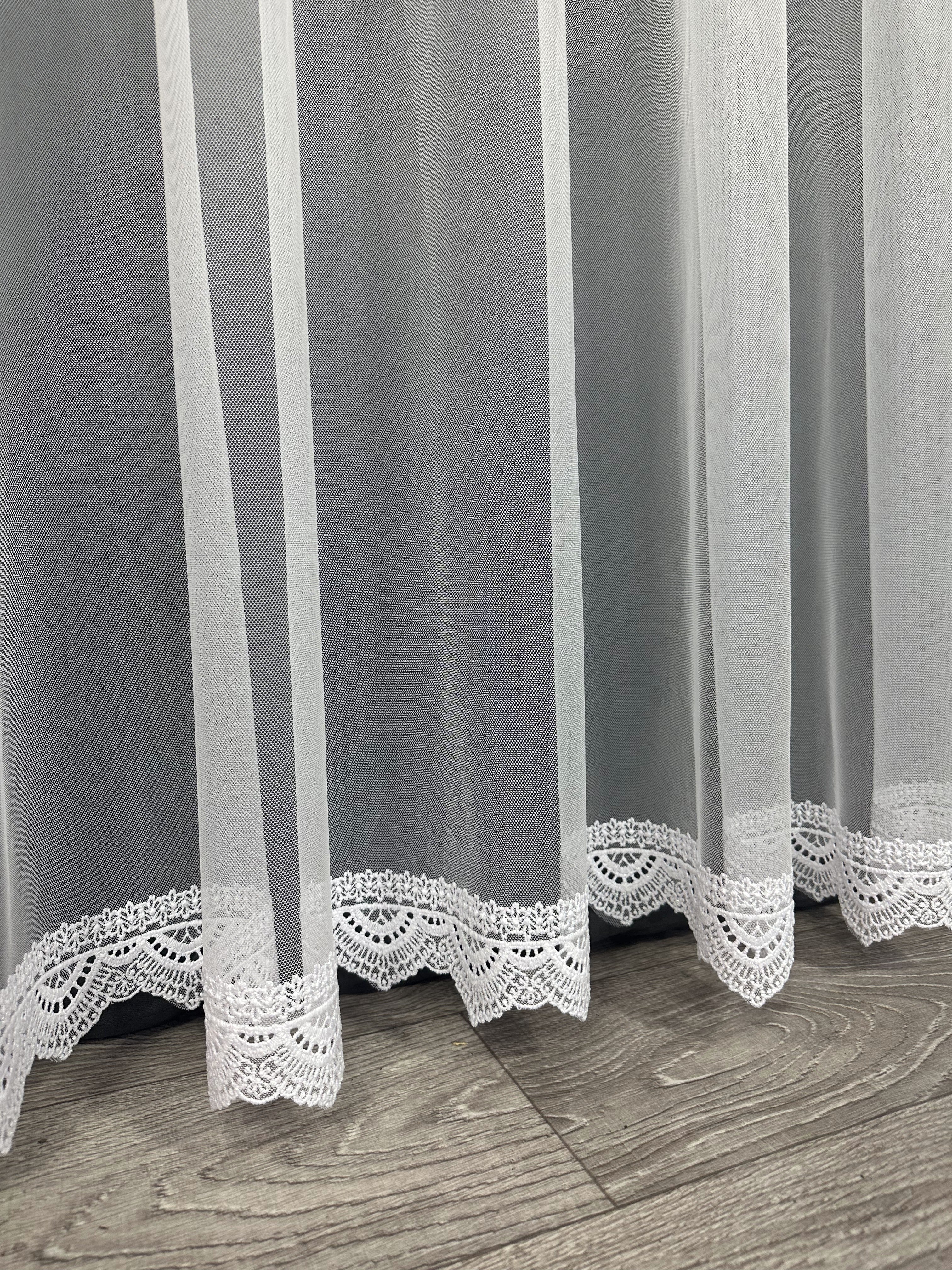 Sheer curtain with beautiful embroidery at the bottom, white color