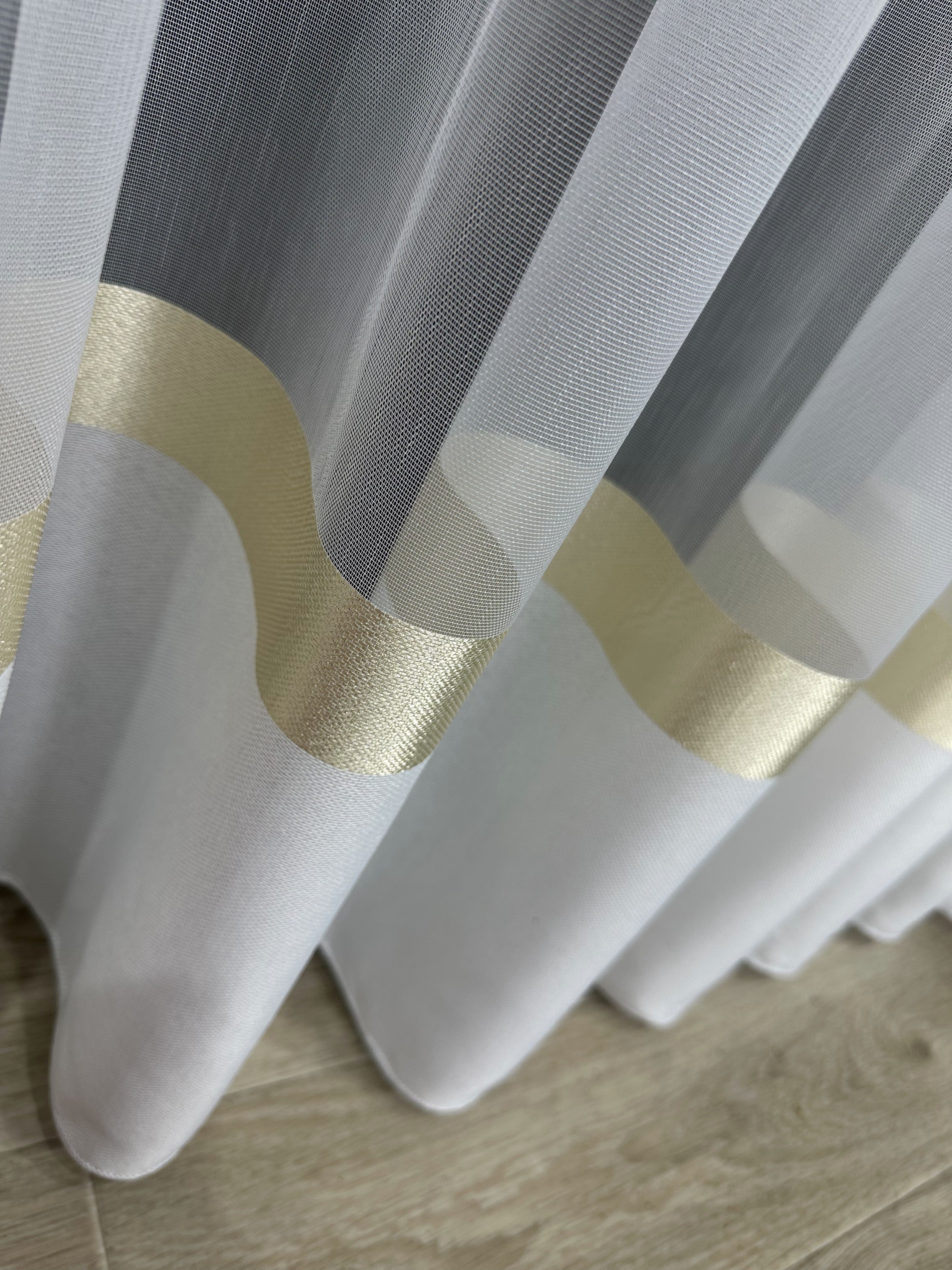 Sheer curtain with stripes and satin inserts, golden color