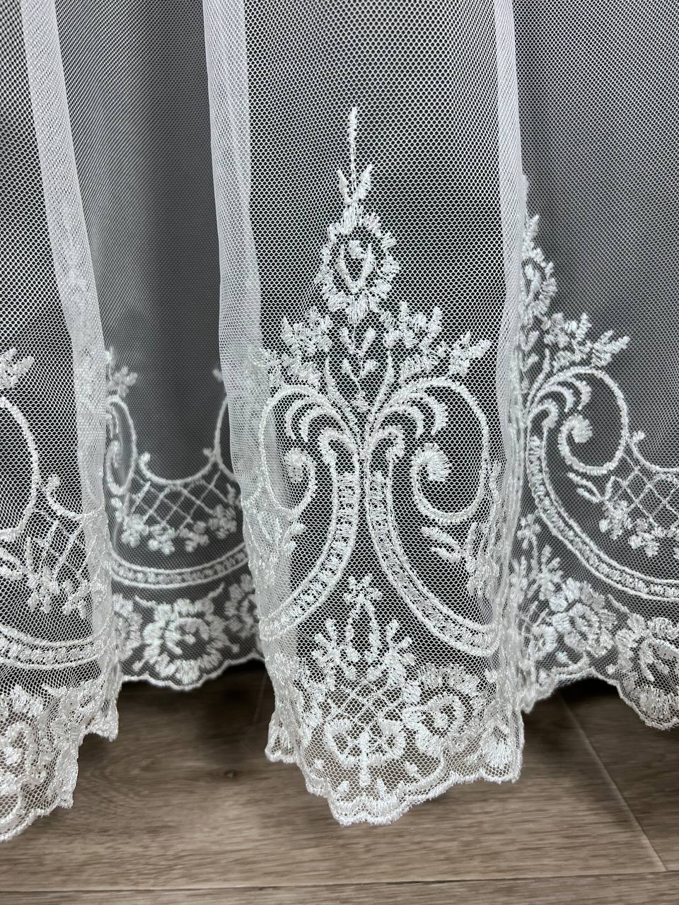 Sheer curtain with beautiful embroidery at the bottom, white color